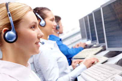 Call center agents working at computers.